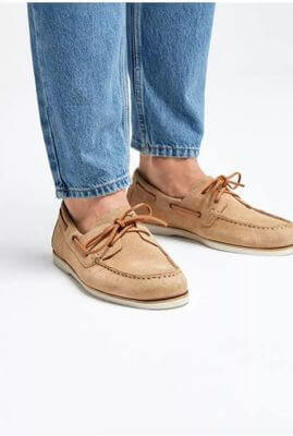 Beige leather boat shoes, worn with jeans